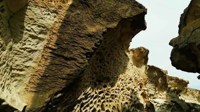 tafoni canyon inside view from drone top down openwork porous ybykty sai walls tafoni narrow rocky kazakhstan mangystau 4k