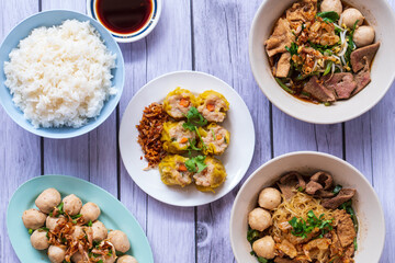 dim sum - steamed minced pork dumplings with sweet sauce.Placed in the middle of the table and there are other Thai dishes beside