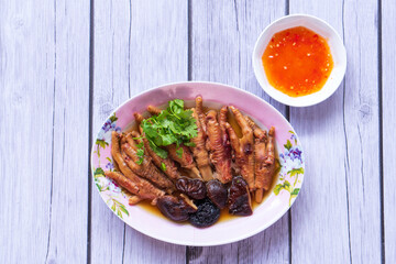 Chinese Cooked Chicken Feet in bamboo steamer