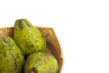 Three avocados in a woven bamboo basket. Avocados are rich in monounsaturated fats and antioxidants, which help support a healthy skin membrane and prevent free radical damage that leads to aging.