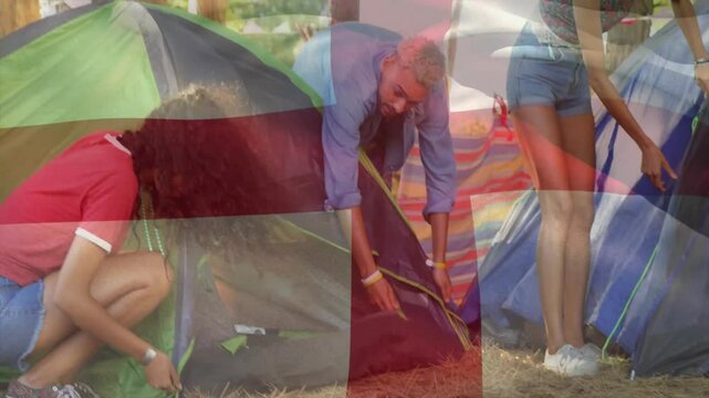 Setting up tents at campsite, people arranging gear with animation flag overlay