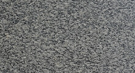 Granite stone texture surface background featuring gray and black spots