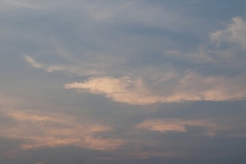 Serene Evening Sky with Soft Blue and Pink Clouds at Dusk