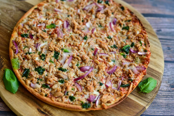 High protein low carb pizza with tuna onion and vegetables.
 Ketogenic diet food 