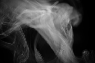 Ethereal Smoke Swirls on a Dark Background Creating Mysterious Atmosphere