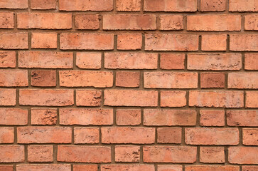 Colorful old red brick wall closeup