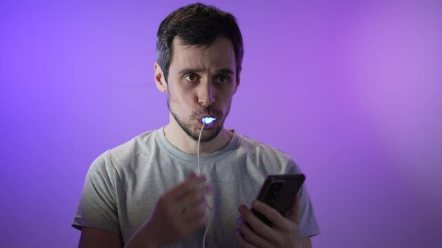 Man Uses LED Whitening Kit at Home for Brighter Smile