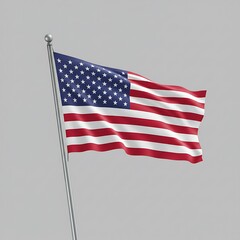 The American flag proudly waves, a symbol of freedom and patriotism against a simple grey background.
