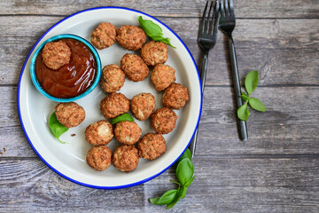 Mini pork meatballs with salsa filling.
 Party fingerfood. Diet  ketogenic food.
