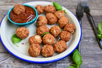 Mini pork meatballs with salsa filling.
 Party fingerfood. Diet  ketogenic food.