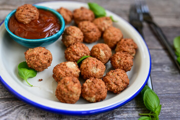 Mini pork meatballs with salsa filling.
 Party fingerfood. Diet  ketogenic food.