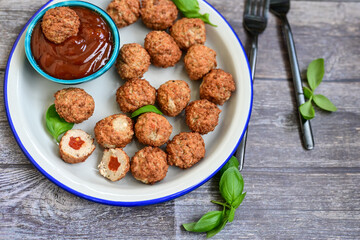 Mini pork meatballs with salsa filling.
 Party fingerfood. Diet  ketogenic food.