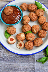 Mini pork meatballs with salsa filling.
 Party fingerfood. Diet  ketogenic food.