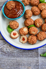 Mini pork meatballs with salsa filling.
 Party fingerfood. Diet  ketogenic food.