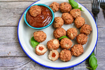 Mini pork meatballs with salsa filling.
 Party fingerfood. Diet  ketogenic food.