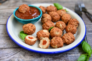 Mini pork meatballs with salsa filling.
 Party fingerfood. Diet  ketogenic food.