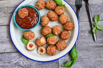 Mini pork meatballs with salsa filling.
 Party fingerfood. Diet  ketogenic food.