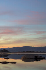 End of drought in Spain Gabriel y Galan reservoir in Extremadura at sunset vertical