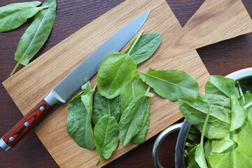 Bunch of fresh sorrel on a wooden background
