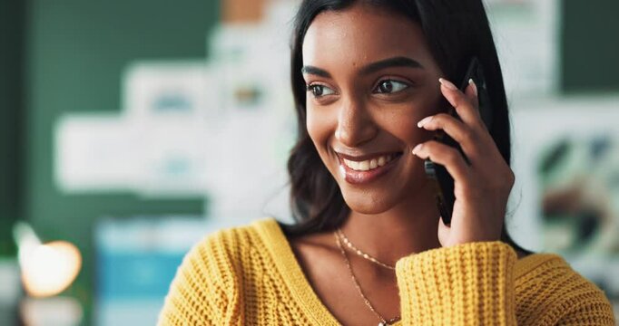 Happy woman, discussion and designer with phone call for proposal or business idea at office. Young indian, creative or female person with smile on mobile smartphone for conversation on startup