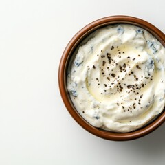 A creamy blue cheese yogurt dip with cracked pepper, gourmet and intense, isolated on white background