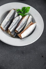 Sardines salted fish gourmet food background on the table rustic food top view copy space vegetarian food
