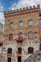 The historic Palazzo Comunale (Palazzo del Popolo)- Town Hall in San Gimignano, Italy, showcasing its majestic architecture and rich history