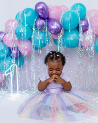 Beautiful baby, black girl, dressed as a princess celebrating her 1st birthday on a beautiful...