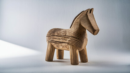 Wooden horse sculpture with carved lines