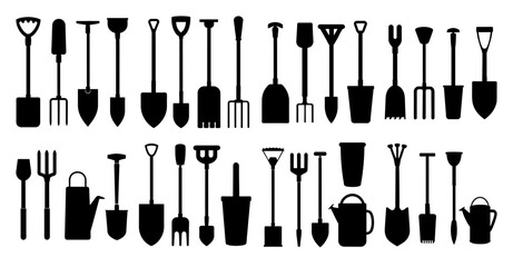 Collection of gardening tools silhouettes showing various types of spades shovels forks rakes and watering cans © pixostudio