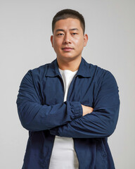 Man with crossed arms in casual jacket