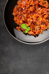 Eggplant stew vegetable dish salad tasty fresh gourmet food background on table rustic food top view copy space