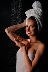 Fototapeta premium Beauty portrait of a woman in lingerie with towel in studio setting