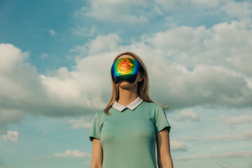 Woman with futuristic visor under a cloudy sky