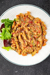 Eggplant dip aubergine salad Baba ganoush eggplant, tomato, onion vegetable dish fresh gourmet food background on table rustic food top view copy spac