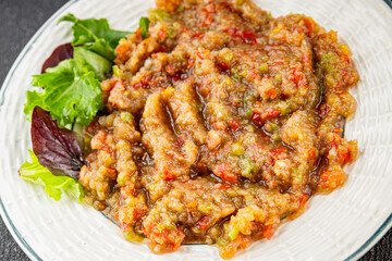 Eggplant dip aubergine salad Baba ganoush eggplant, tomato, onion vegetable dish fresh gourmet food background on table rustic food top view copy spac