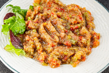 Eggplant dip aubergine salad Baba ganoush eggplant, tomato, onion vegetable dish fresh gourmet food background on table rustic food top view copy spac