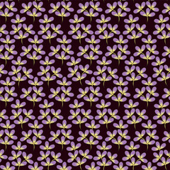 Vintage seamless floral pattern. Ditsy style background of small flowers. Ditsy floral over light yellow background. Small flower pattern for fashion, wrapping, printing on fabrics and surface