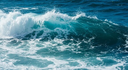Fototapeta premium Ocean Wave Crashing on Shore - A powerful ocean wave crashes, creating white foam and turquoise water. Perfect for travel, nature, or ocean-themed projects