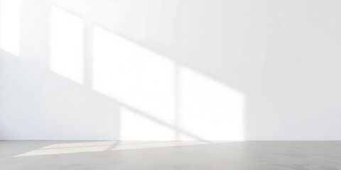 Fototapeta premium A minimalist empty wall with soft natural lighting, smooth neutral surface and subtle texture, featuring strong hard light, a distinct split, divided sections, bold areas, and direct harsh shadows