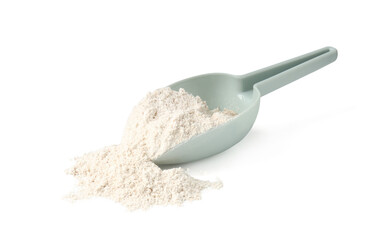 Pile of brown rice flour and scoop isolated on white