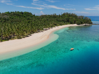 defaultHuha Island, Gorontalo - Indonesia: Aerial view of beautiful tropical island with white sand beach and turquoise sea 