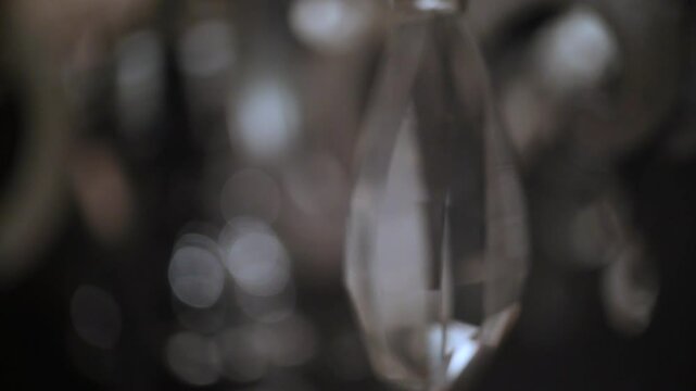 Horizontal video of turned on electric lamp indoors.