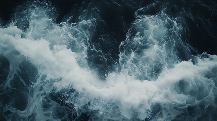 Fototapeta premium A massive, dark blue wave with white foam rolling over in the ocean, captured from an extreme closeup perspective