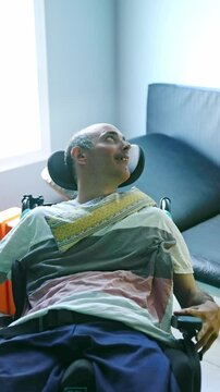 Man with Disability Smiling During Relaxation Time Indoors