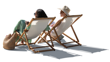 Two women on beach vacation relaxing in sling chairs and talking. Backlit image isolated on...