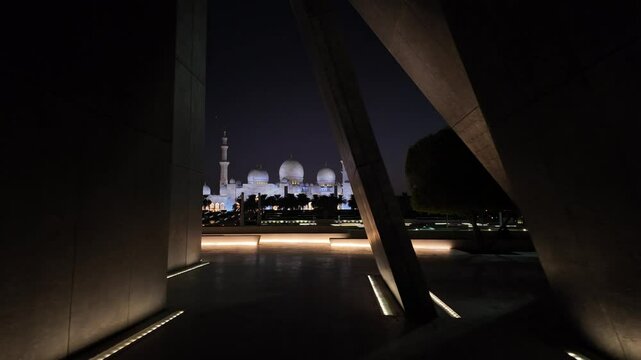 Sheikh Zayed Grand Mosque in Abu Dhabi at night as seen from Wahat Al Karama
