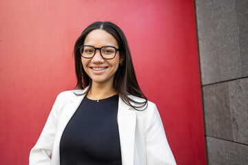 Confident Hispanic Businesswoman in Modern Office Setting