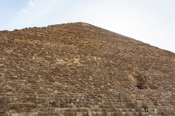 Explore the ancient stones that constitute the Great Pyramid of Keops in Giza, Egypt, a modern world wonder. Witness the architectural marvel and historical.