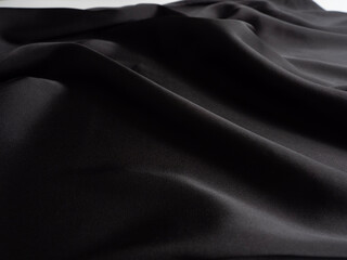 Close-up of black silk fabric. Background, texture